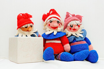Three small crocheted elves on white background 