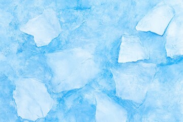 Obraz premium A serene blue ice texture with irregular ice pieces scattered across a cool surface.
