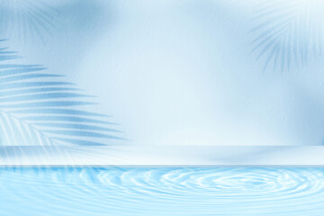 Water texture in swimming,poolside with light,shadow palm leaves on blue cement wall Background...