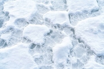 Obraz premium Close-up of thick, soft snow covering the ground, creating a tranquil winter scene with a cool color palette.