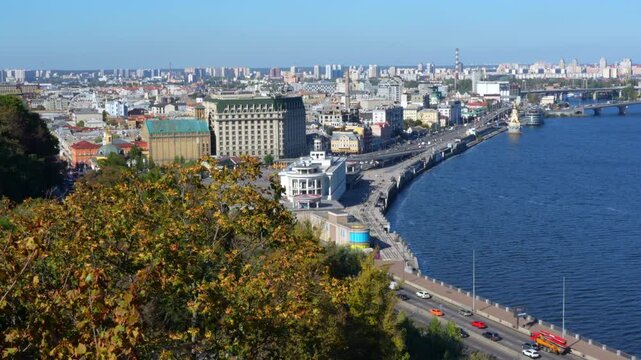 Kyiv, Ukraine - October 9, 2024: Panoramic view of Poshtova Square and Podil district in Kyiv, showcasing riverside architecture and vibrant urban atmosphere.