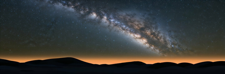 Naklejka premium Vast night sky revealing the beauty of the Milky Way over a tranquil landscape at twilight