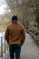 person walking in the city opole near the river