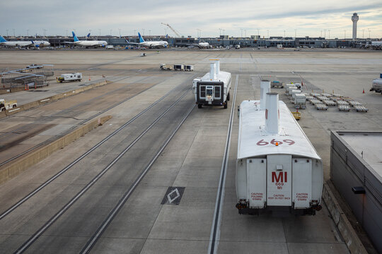 Dulles Airport, Washington, bus transportation between terminals with tower and aircrafts.