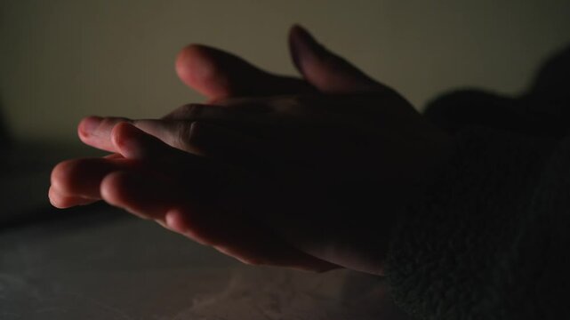 Male hands close-up.
A man rubs his palms.
The man strokes his hands.
The man is worried and rubs his palms