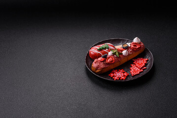 Sweet eclair with chocolate filling, decorated for Christmas