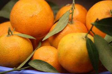 Fresh Small Oranges with Green Leaves