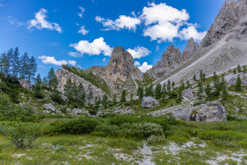Dolomites sunny weather in summer mountains. Green valley and beautiful mountain rocky peaks in the Alps. Alpine scenic landscape in South Tyrol region in Italy