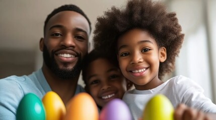Smiling family with colorful eggs. Joyful father and children celebrating Easter holiday indoors.