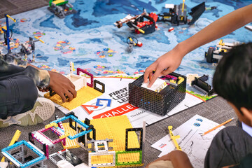 Obraz premium Toronto, Ontario, Canada - November 30: Group students working on robotics project for the FIRST LEGO League (FLL) competition. STEM eduction concept.