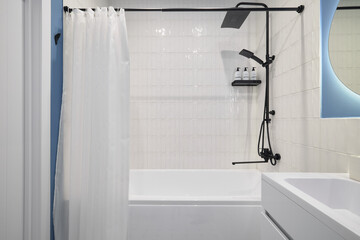 A modern bathroom with a sleek bath and shower combo for ultimate convenience and comfort