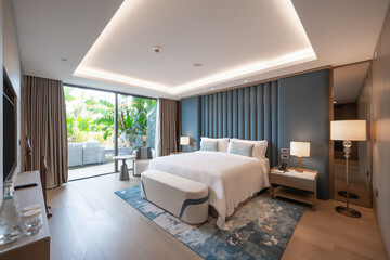 Modern hotel room with a bright and airy feel, a luxury hotel room. Example of a hotel room, modern furnishings and architecture.