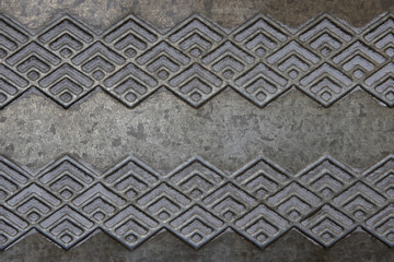 Metallic background in gray and angled patterns. Processed with stacked focus and Depth Compositing.