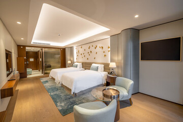 Modern hotel room with a bright and airy feel, a luxury hotel room. Example of a hotel room, modern furnishings and architecture.