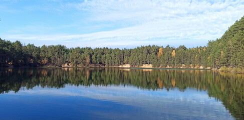 Forest lake with emerald water. Beautiful water panorama
