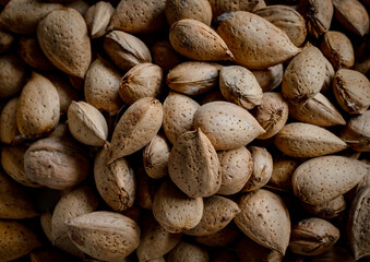 Obraz premium Top view close up photo of almonds. Food concept.