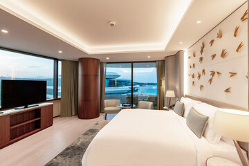 Modern hotel room with a bright and airy feel, a luxury hotel room. Example of a hotel room, modern furnishings and architecture.
