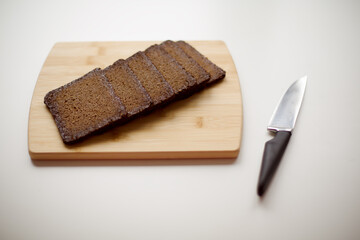  Freshly Sliced Rye Bread on a Wooden Cutting Board