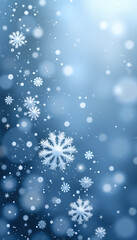 Beautiful winter background with falling snowflakes and bokeh effect in blue tones