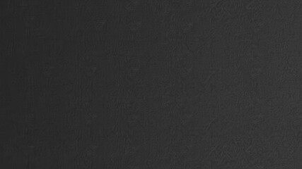 Fototapeta premium Black paper with a smooth, matte texture ideal for backgrounds or overlays on designs, abstract, simple