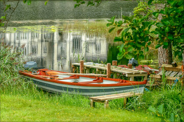 353 ylemore Abbey and rowboat in Connemara, Co. Galway, Ireland, reflected