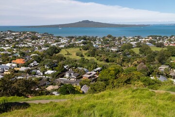 Panoramic view from Mt Victoria hilltop. Houses, a park, and the Hauraki Gulf are visible. Mt...