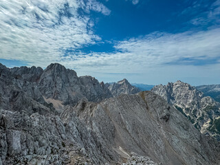 Panoramic view of rugged mountain ridge Lipnica seen from top of summit Spik, wild Julian Alps....