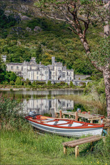 404 Kylemore Abbey and rowboat in Connemara, Co. Galway, Ireland, reflected
