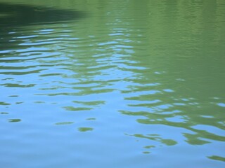 Fototapeta premium Crystal clear water with mesmerizing ripples reflecting sunlight, serene, abstract, surface