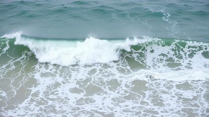 Powerful sea water wave crashing on the shore, creating a foamy splash, nature, energy