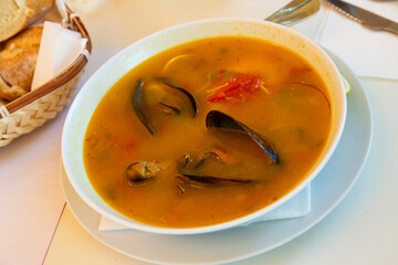 Spicy seafood soup with king prawns, shellfish and octopus. High quality photo