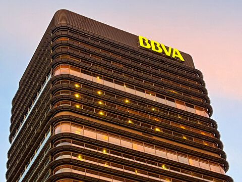 Madrid, Spain - 09 December 2023: close-up of bbva building at dusk in madrid
