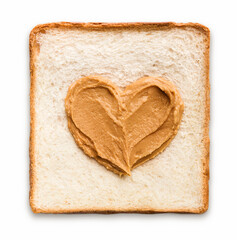 Peanut butter spread in a heart shape on a piece of toast, top view
