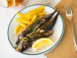 Grill pub and fish restaurant menu, grilled mackerel with lemon, herbs and potatoes