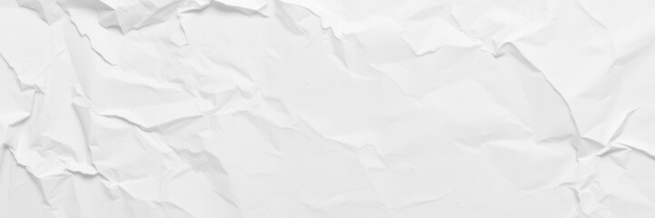 Crumpled white paper with soft shadows on a gray surface, wrinkled paper, background