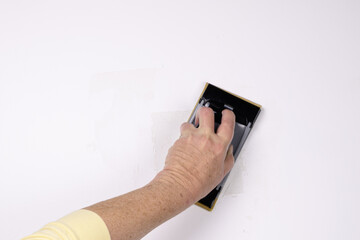 sanding patch on a white wall 