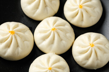 Steamed Teriyaki chicken and vegetable bao buns served with Asian style salad