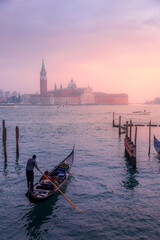 Venice, Italy - February 4, 2024: San Giorgio Maggiore Island and Traditional Gondolas in Venice, Italy