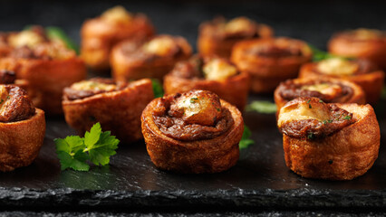 Mini Yorkshire puddings with shredded beef and gravy