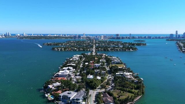 Drone view of San Marino Island, Venetian Islands, Rivo Alto Island and Miami Beach. Several islands connected by road surrounded by water. Skyline with tall buildings