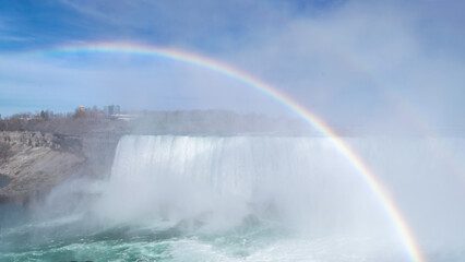Fototapeta premium Close-up of the blurred streams of Niagara Horseshoe Falls with bokeh effect.