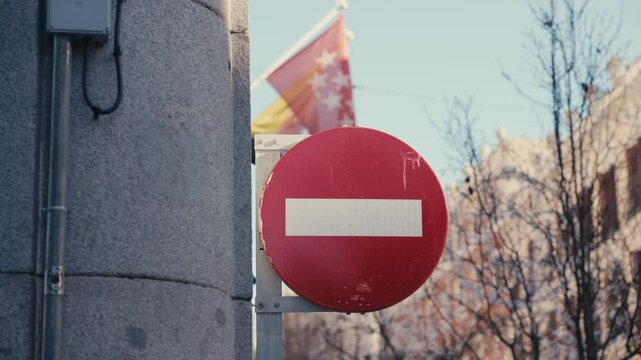 A prominent no-entry sign restricts vehicle access to central areas of Madrid, Spain, as part of ecological regulations to reduce emissions and improve air quality. The European city's environmental