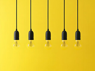 Hanging Light Bulbs on Yellow Background for Innovation and Creativity Concept