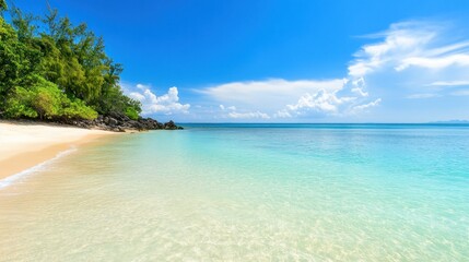 Fototapeta premium Serene Tropical Beach Paradise: Idyllic Shoreline, Azure Waters, and Lush Greenery under a Sunny Sky