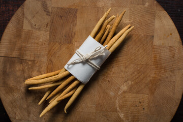Top view of fried corn stick snack on a wood board, Overhead view of nigerian kokoro corn snack	