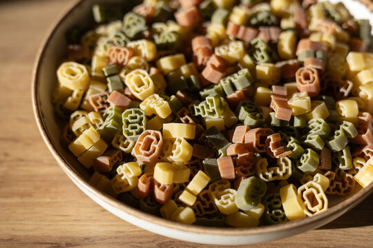 Multi-colored number shaped pasta in a bowl