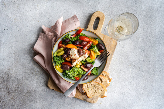 Healthy kale salad with feta and olives, top view