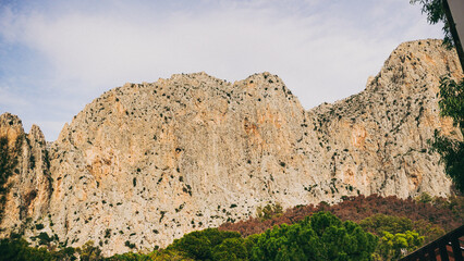 Majestic Rocky Cliffs Beneath a Strikingly Vibrant Blue Sky, Showcasing Natures Grandeur and Beauty