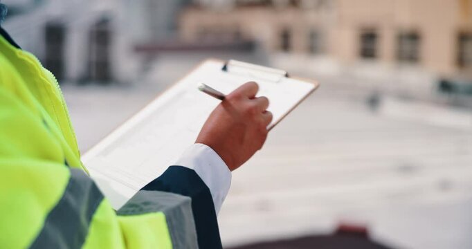 Person, civil engineer or hands writing with clipboard in city for architecture, inspection or industrial development. Closeup, contractor or building inspector with checklist for construction safety
