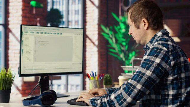 Software developer at computer coding, creating software, implementing algorithms. IT expert in home office working with code editor, building applications, optimizing performance, camera B